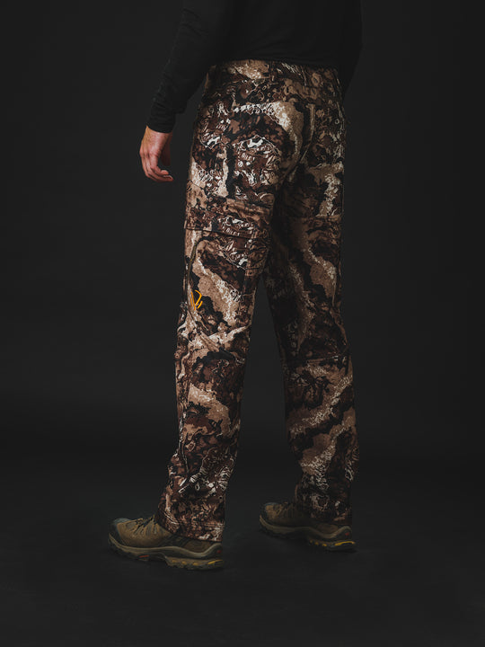 The Veil® Camo Field Pant is the most talked-about pant coming out for your next hunt. This multi-season, multi-purpose pant is comfortable and offers an athletic fit. With double weave 4-way stretch you can't go wrong with this pant!  PROTECTION Quick-drying, Windproof, Water Resistant. MATERIAL Exterior: 92% Polyester 8% Synthetic Fiber. FIT: Midweight and Multi-Season. CONDITIONS Mild, Dry, Cold, Wet, Wind. PATTERN Veil® Camo in Grind.Multi-Season Gear & Pursuits