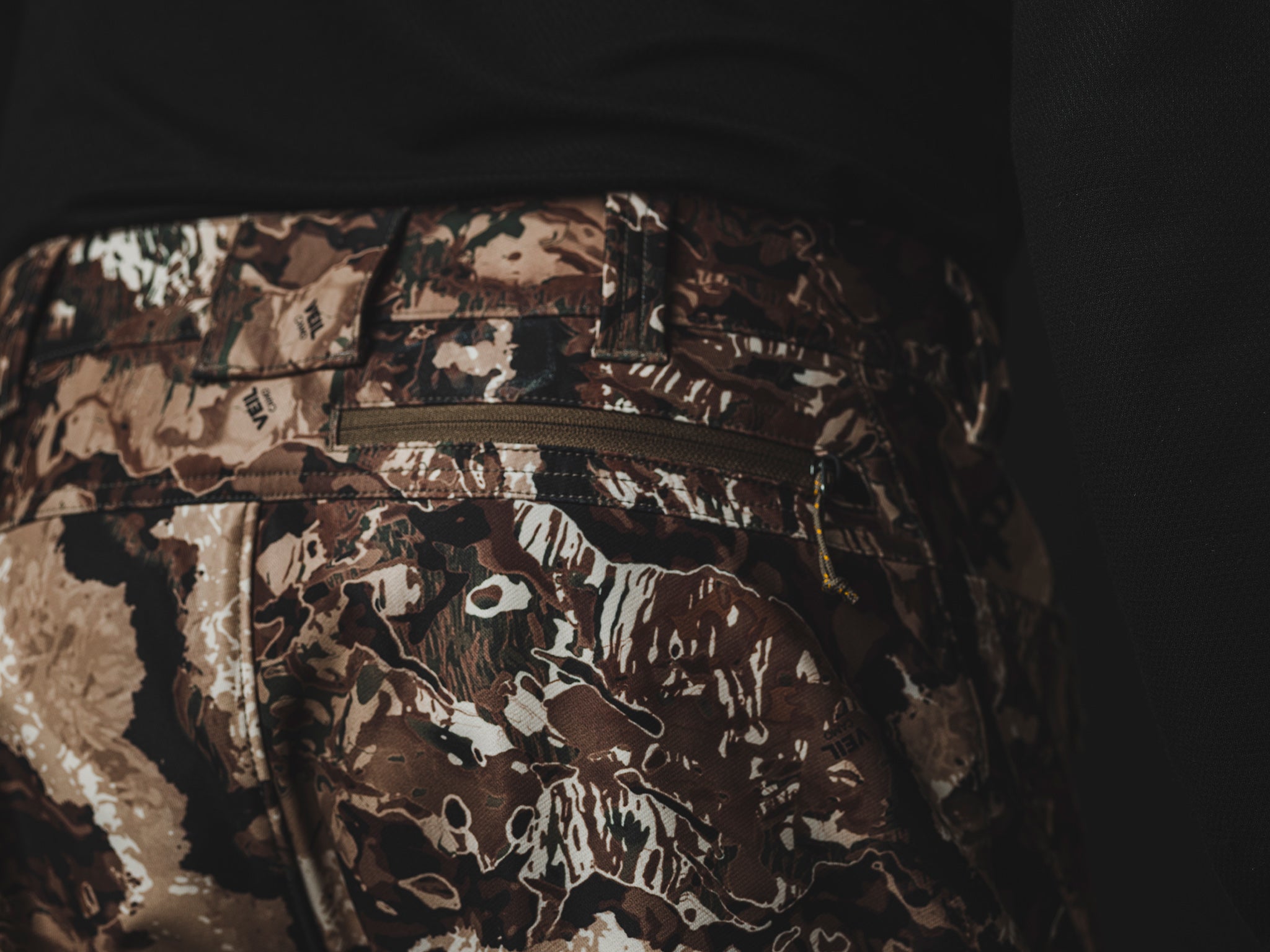 The Veil® Camo Field Pant is the most talked-about pant coming out for your next hunt. This multi-season, multi-purpose pant is comfortable and offers an athletic fit. With double weave 4-way stretch you can't go wrong with this pant!  PROTECTION Quick-drying, Windproof, Water Resistant. MATERIAL Exterior: 92% Polyester 8% Synthetic Fiber. FIT: Midweight and Multi-Season. CONDITIONS Mild, Dry, Cold, Wet, Wind. PATTERN Veil® Camo in Grind.Multi-Season Gear & Pursuits