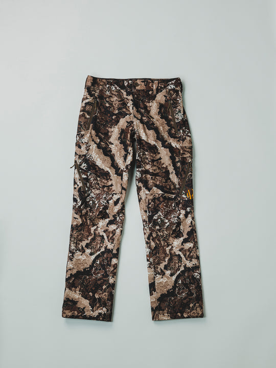 The Veil® Camo Field Pant is the most talked-about pant coming out for your next hunt. This multi-season, multi-purpose pant is comfortable and offers an athletic fit. With double weave 4-way stretch you can't go wrong with this pant!  PROTECTION Quick-drying, Windproof, Water Resistant. MATERIAL Exterior: 92% Polyester 8% Synthetic Fiber. FIT: Midweight and Multi-Season. CONDITIONS Mild, Dry, Cold, Wet, Wind. PATTERN Veil® Camo in Grind.Multi-Season Gear & Pursuits