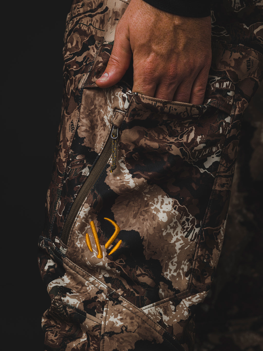 The Veil® Camo Field Pant is the most talked-about pant coming out for your next hunt. This multi-season, multi-purpose pant is comfortable and offers an athletic fit. With double weave 4-way stretch you can't go wrong with this pant!  PROTECTION Quick-drying, Windproof, Water Resistant. MATERIAL Exterior: 92% Polyester 8% Synthetic Fiber. FIT: Midweight and Multi-Season. CONDITIONS Mild, Dry, Cold, Wet, Wind. PATTERN Veil® Camo in Grind.Multi-Season Gear & Pursuits